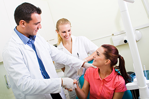 dentists greeting female patient in dental chair, botox treatment Beaver Dam, WI